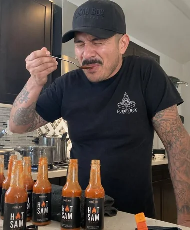 Hot Sam's founder tasting hot sauce