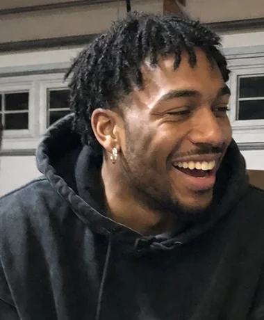 Marcus Reyes laughing in his garage